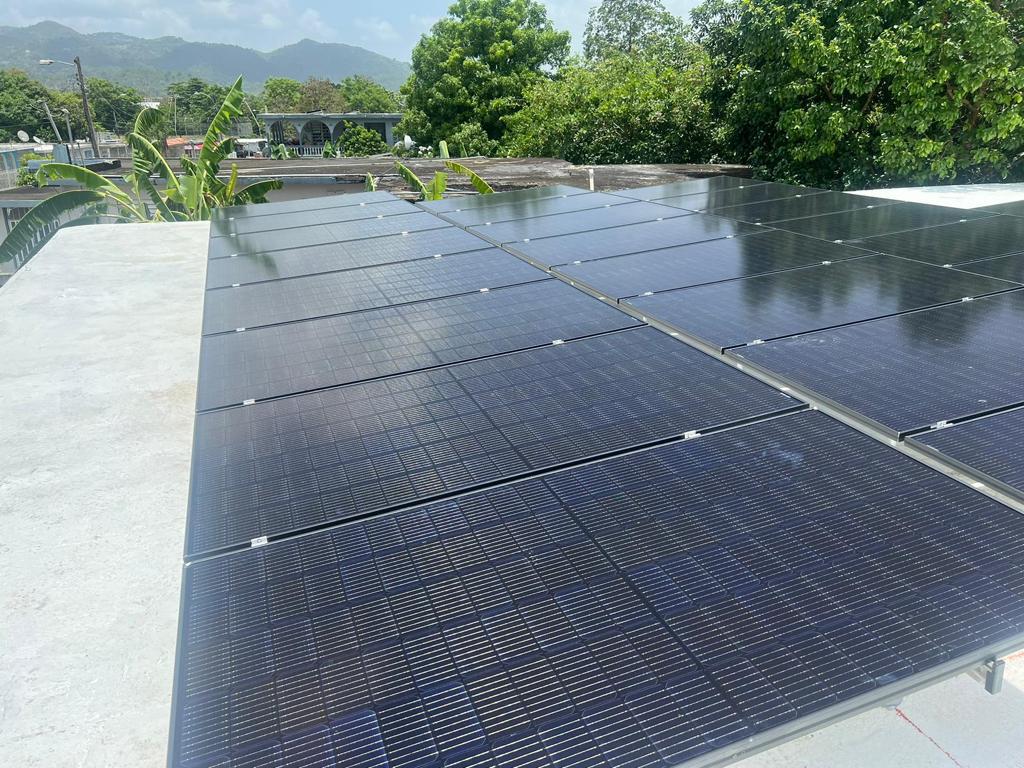 Skyward Rooftop Solar Energy with Puerto Rico background